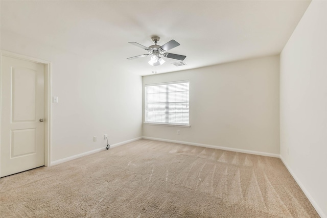 empty room with light carpet and ceiling fan