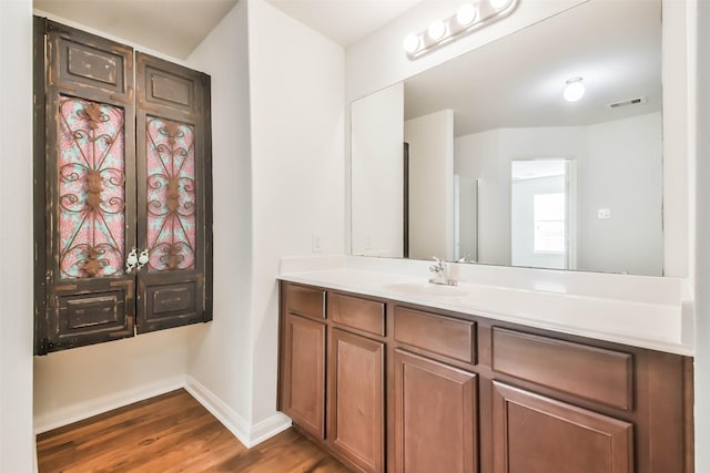 bathroom with wood-type flooring and vanity