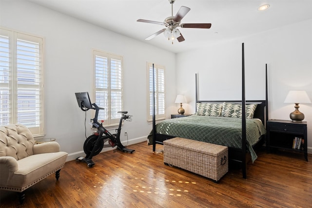 bedroom with ceiling fan and wood-type flooring