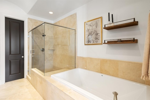 bathroom with tile patterned flooring and independent shower and bath