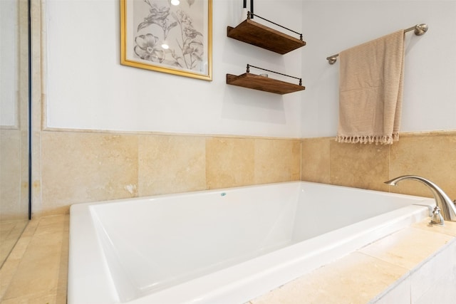 bathroom with tiled bath