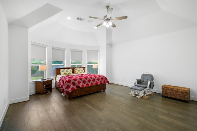 bedroom featuring ceiling fan, dark wood-type flooring, and vaulted ceiling