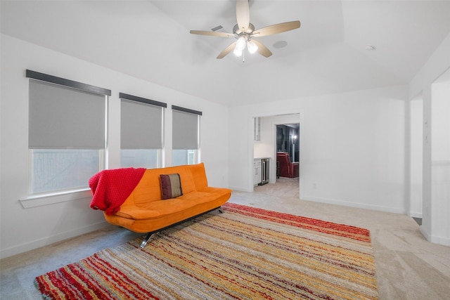 sitting room featuring ceiling fan, lofted ceiling, and light carpet