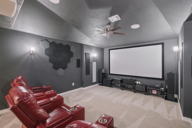 carpeted cinema featuring ceiling fan and lofted ceiling