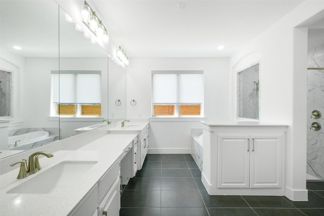 bathroom with tile patterned floors, vanity, and independent shower and bath