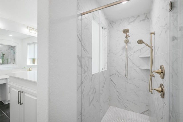 bathroom featuring vanity and an enclosed shower