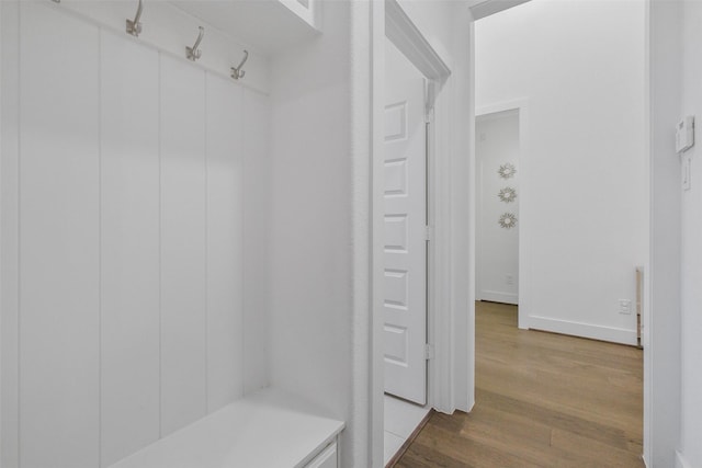 mudroom with wood-type flooring