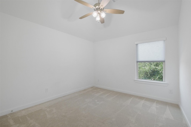 empty room with light carpet and ceiling fan