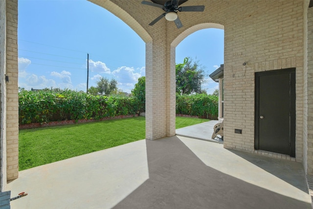 view of patio featuring ceiling fan