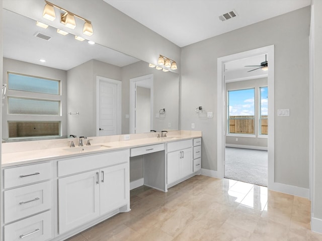 bathroom featuring ceiling fan and vanity