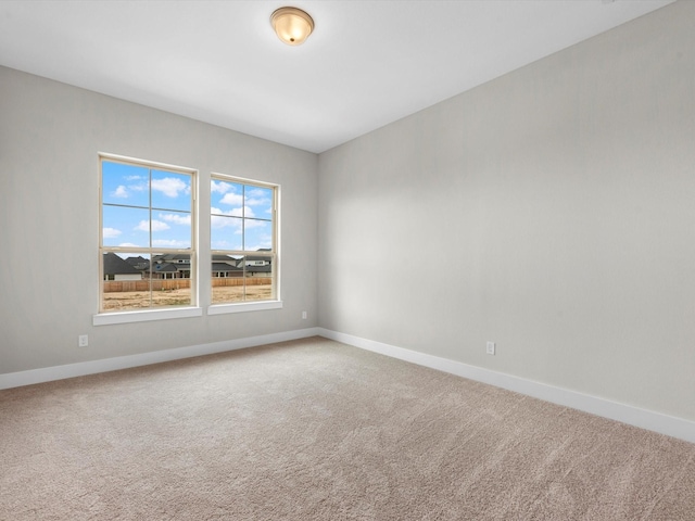 spare room featuring carpet flooring