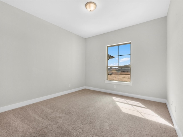 spare room featuring carpet