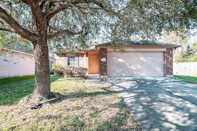 single story home with a garage and a front lawn