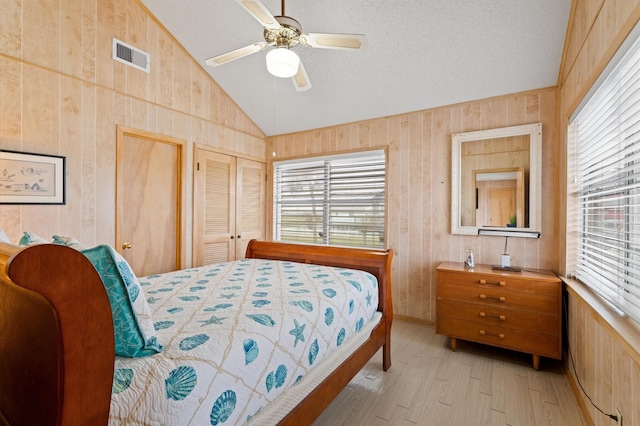 bedroom with ceiling fan and lofted ceiling