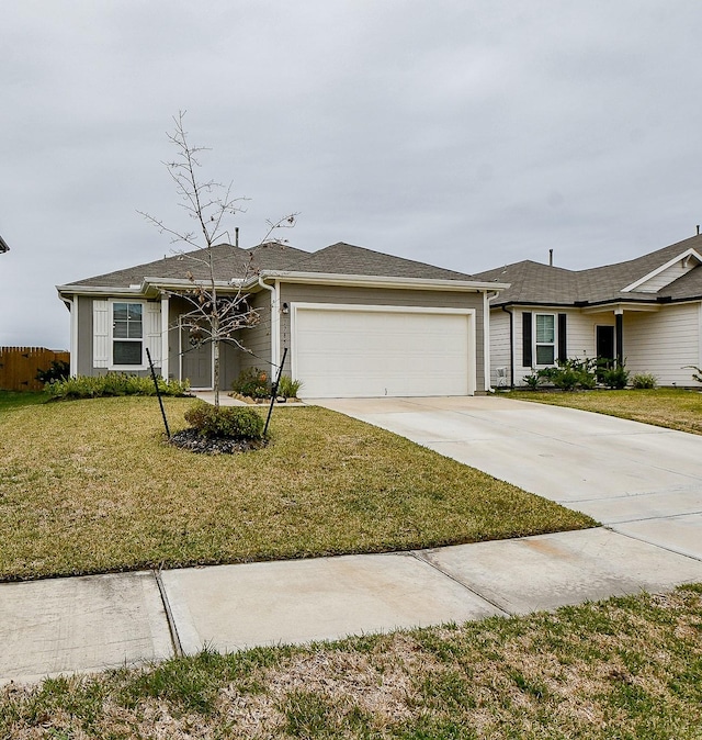 ranch-style house with a garage and a front lawn