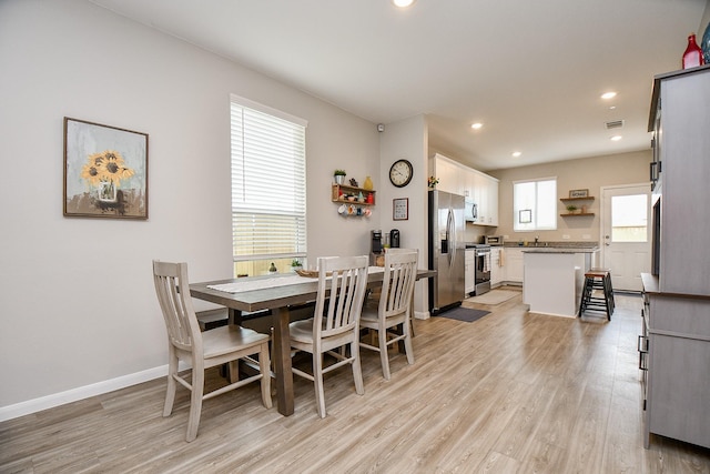 dining room with light hardwood / wood-style flooring