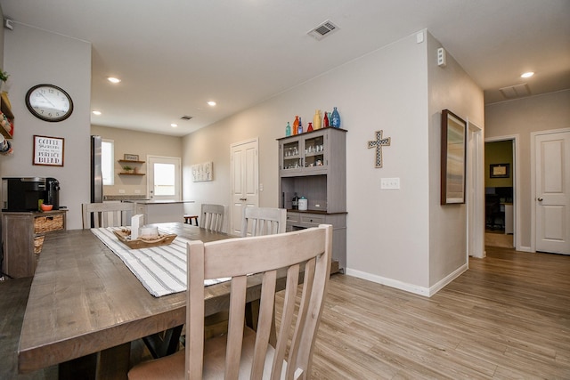 dining area with hardwood / wood-style floors