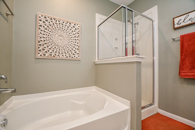 bathroom with shower with separate bathtub