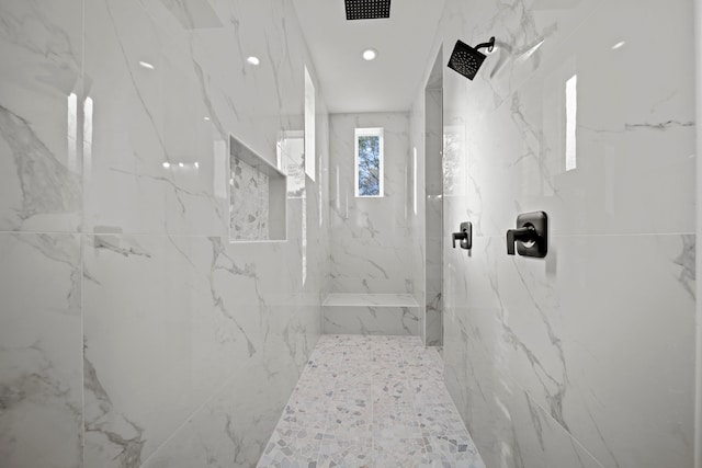 bathroom featuring tiled shower