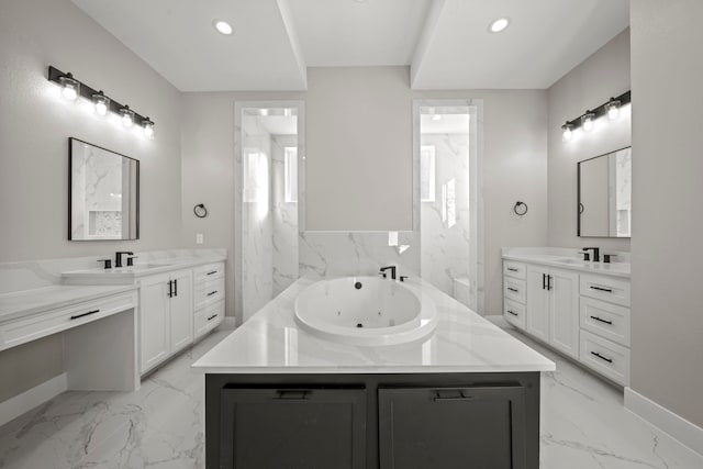 bathroom with vanity and a tub