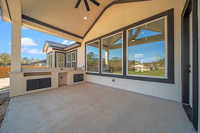 view of patio featuring area for grilling and ceiling fan