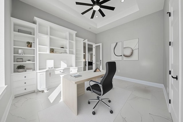 office with ceiling fan and a tray ceiling