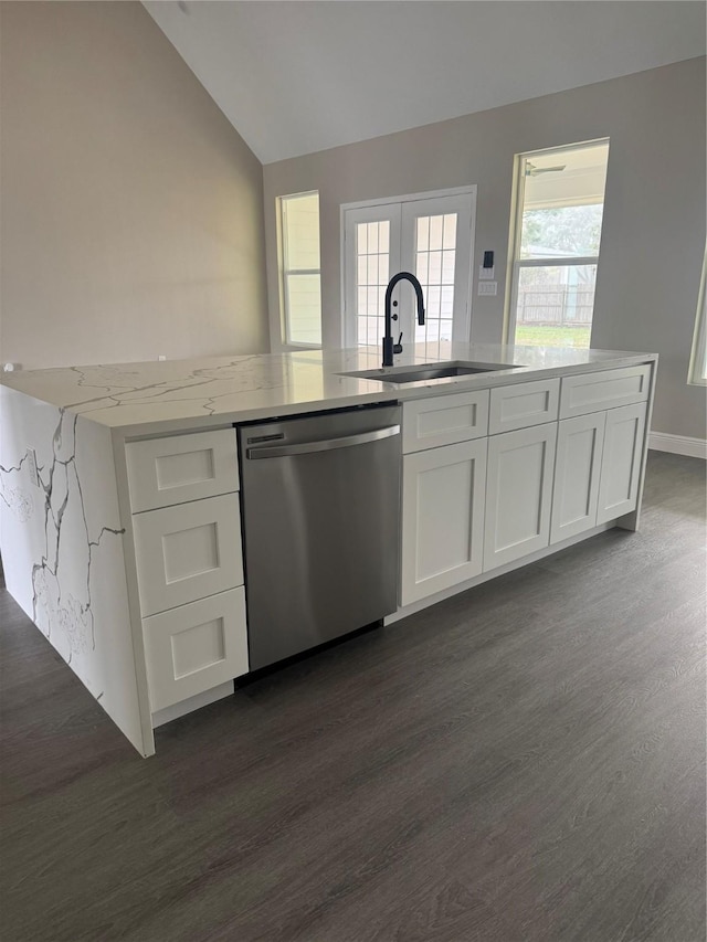 kitchen with white cabinetry, dishwasher, light stone countertops, sink, and vaulted ceiling