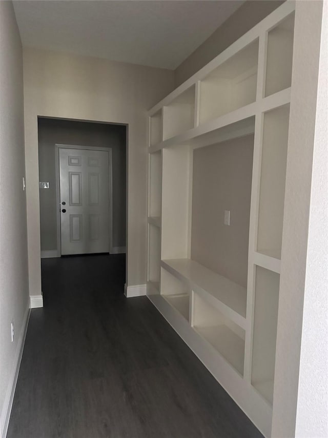 mudroom featuring dark hardwood / wood-style floors and built in features