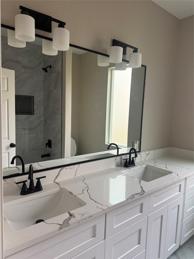 bathroom featuring vanity and an enclosed shower