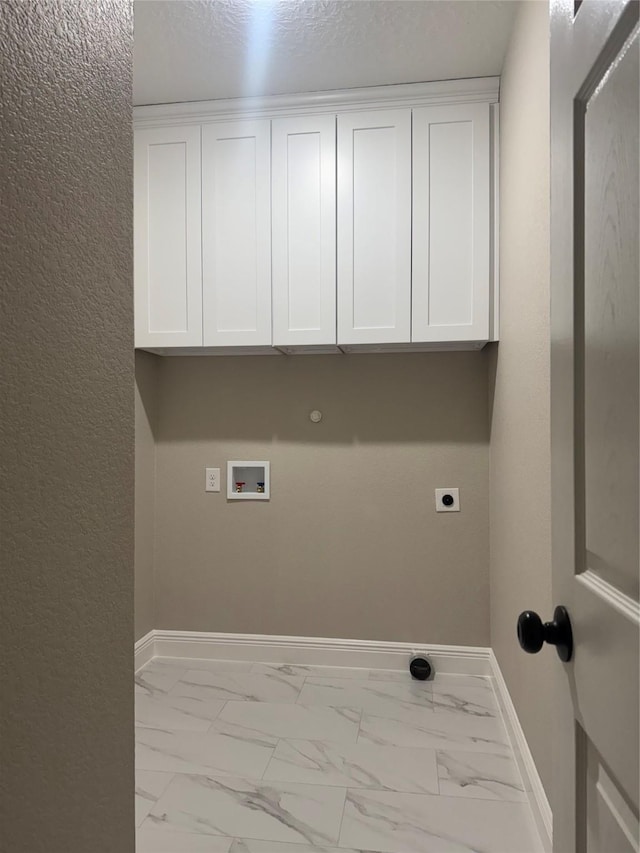 washroom with cabinets, washer hookup, gas dryer hookup, and electric dryer hookup