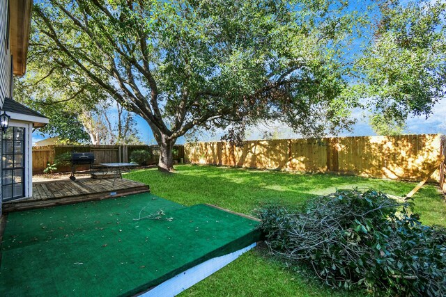 view of yard featuring a wooden deck