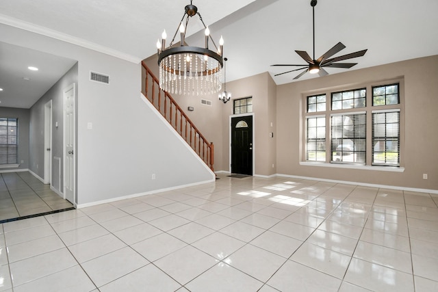 interior space with ceiling fan with notable chandelier and crown molding