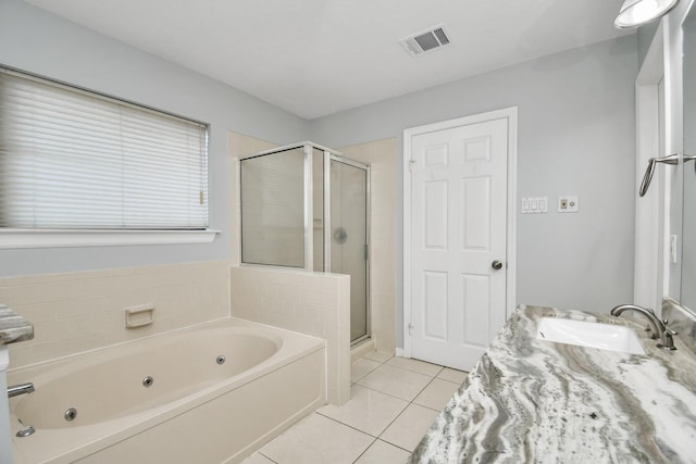 bathroom with plus walk in shower, tile patterned floors, and vanity