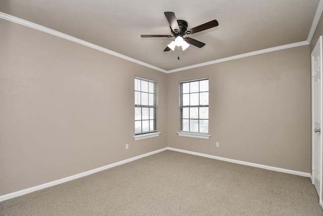 carpeted empty room featuring ceiling fan and ornamental molding