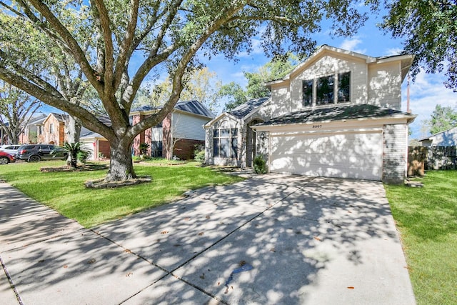 view of front facade with a garage and a front lawn