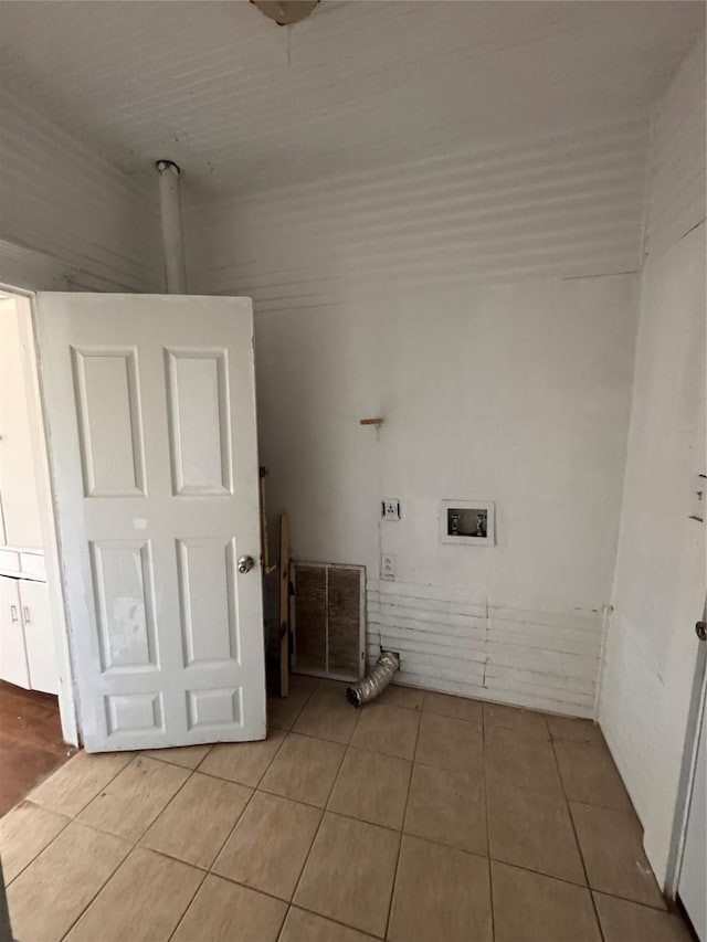 clothes washing area featuring hookup for a washing machine and light tile patterned floors