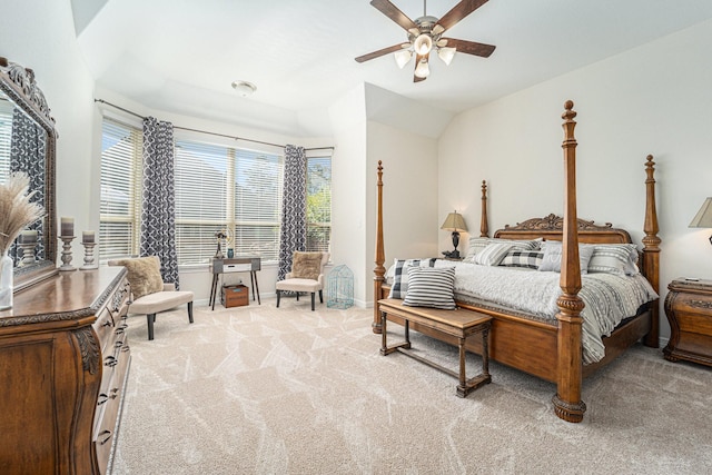 carpeted bedroom featuring ceiling fan and vaulted ceiling