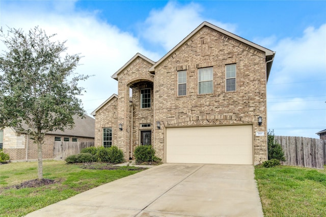 view of front facade featuring a garage and a front yard