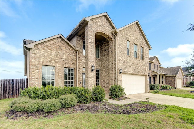 view of front facade with a garage and a front lawn