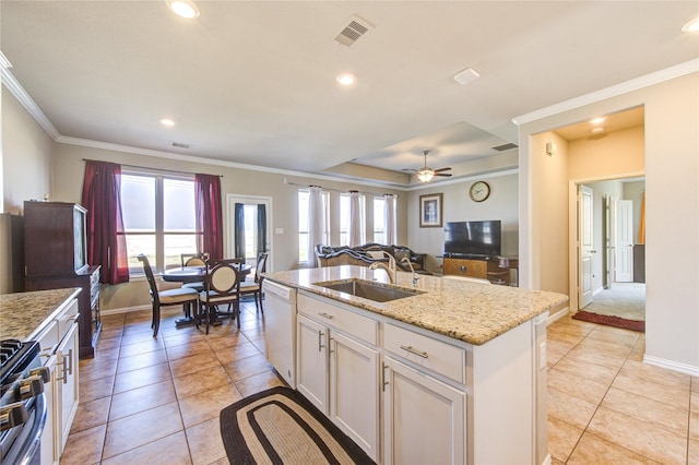 kitchen with sink, stainless steel range oven, white dishwasher, a center island with sink, and white cabinets