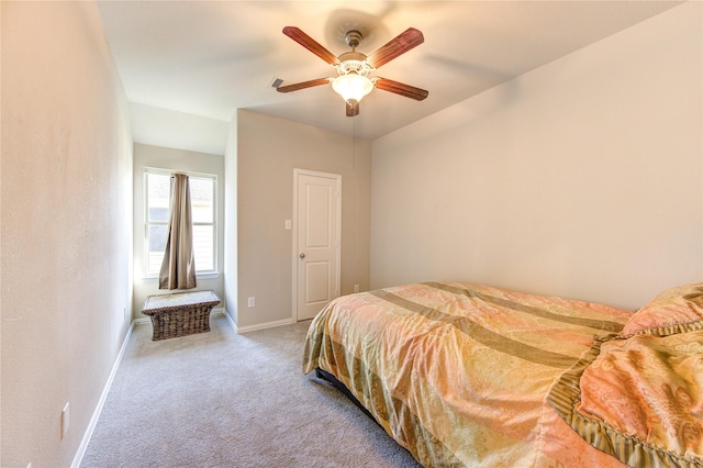 bedroom with light carpet and ceiling fan