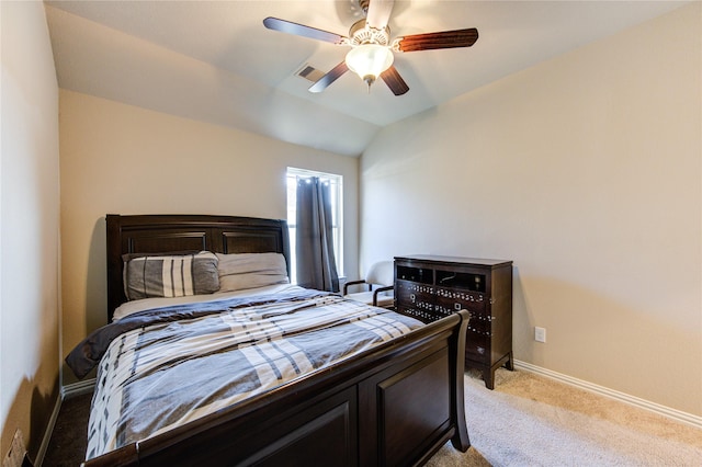 bedroom with ceiling fan, light colored carpet, and lofted ceiling