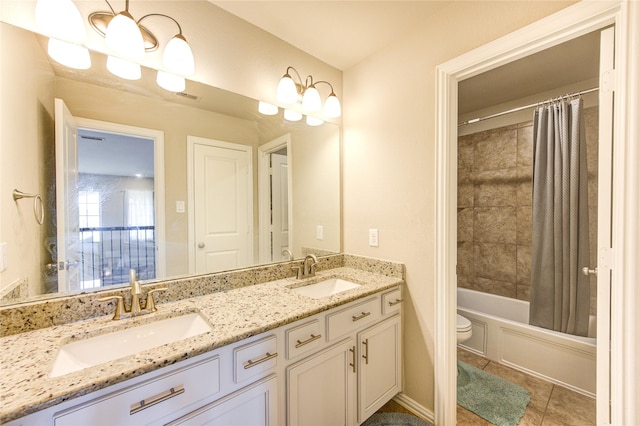 full bathroom featuring tile patterned floors, vanity, shower / bath combination with curtain, and toilet