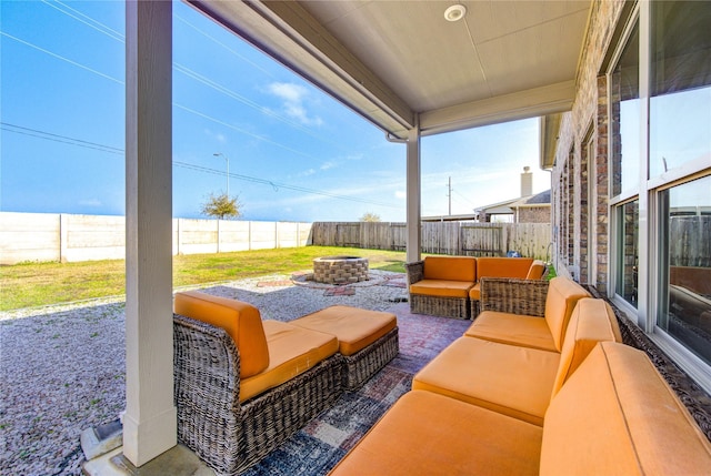 view of patio / terrace with an outdoor living space with a fire pit