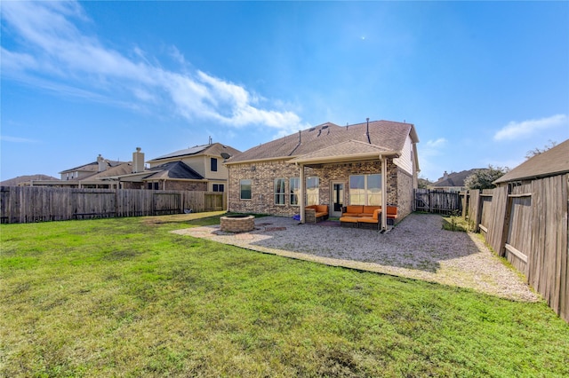 rear view of property with an outdoor hangout area, a patio, and a lawn