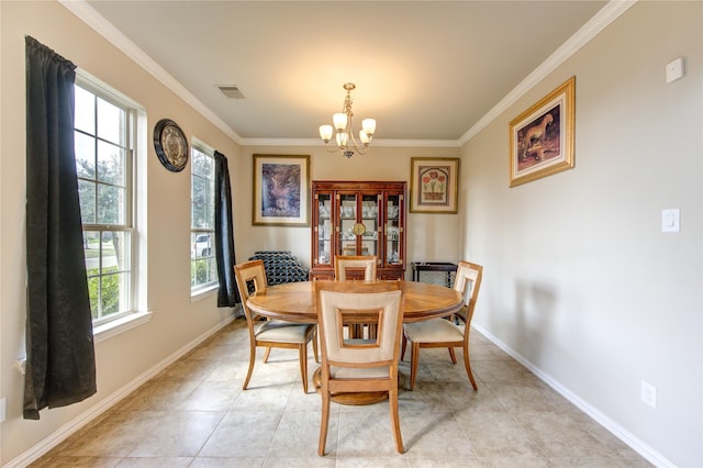 dining room featuring a notable chandelier, ornamental molding, and light tile patterned floors