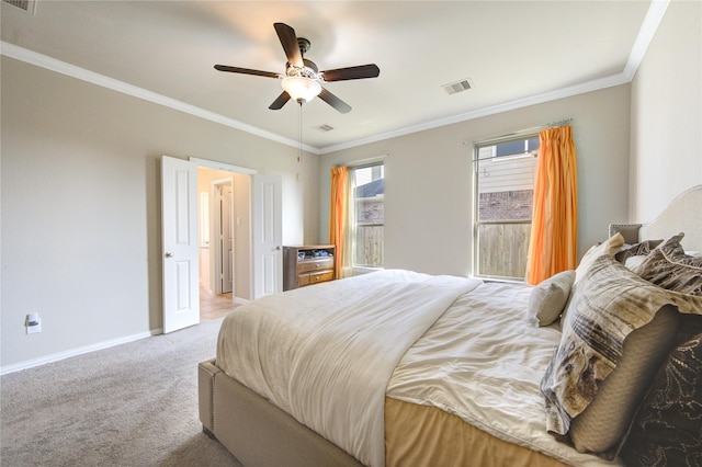 bedroom with ceiling fan, crown molding, and light carpet