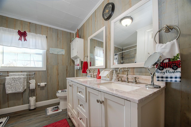 bathroom featuring ornamental molding, a shower with curtain, vanity, wood-type flooring, and toilet