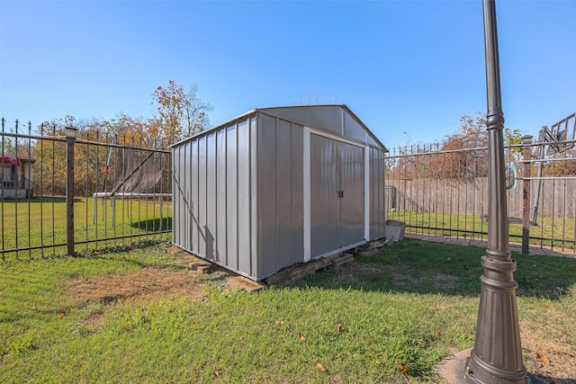 view of outdoor structure with a lawn