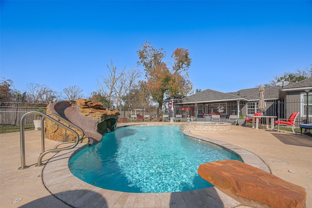 view of swimming pool with a patio